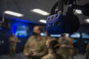 A virtual reality headset hangs from the ceiling at the 317th Maintenance Group VR lab at Dyess Air Force Base, Texas, Mar. 3, 2021. The lab has advanced so far that the Air Education and Training Command for the C-130J Super Hercules crew chiefs’ have integrated the Dyess’ VR training course into their field training detachment curriculum. (U.S. Air Force photo by Senior Airman Mercedes Porter)