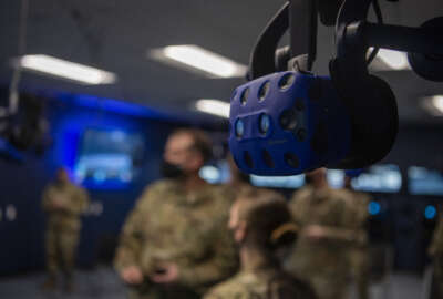 A virtual reality headset hangs from the ceiling at the 317th Maintenance Group VR lab at Dyess Air Force Base, Texas, Mar. 3, 2021. The lab has advanced so far that the Air Education and Training Command for the C-130J Super Hercules crew chiefs’ have integrated the Dyess’ VR training course into their field training detachment curriculum. (U.S. Air Force photo by Senior Airman Mercedes Porter)