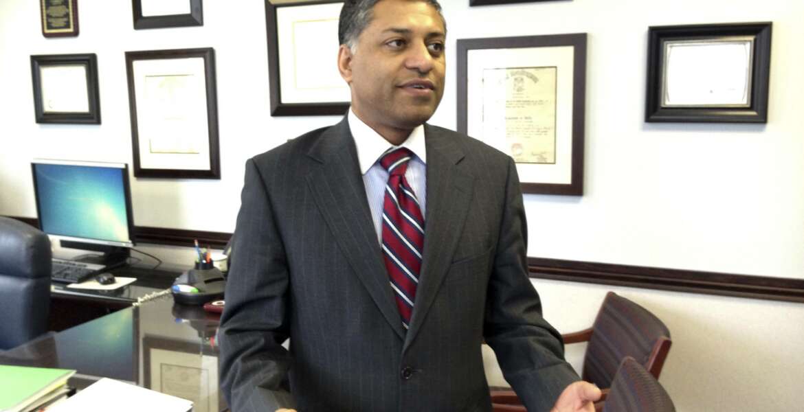 FILE -  In this Feb. 10, 2015 file photo, Dr. Rahul Gupta, state health officer of West Virginia, talks in his office in Charleston, W.Va. President Joe Biden is nominating West Virginia’s former health commissioner as the nation’s top anti-drug official, tapping an official who served on the frontlines of the nation’s opioid epidemic. The White House says Dr. Rahul Gupta will be the first physician to lead the Office of National Drug Control Policy, also known as the “drug czar.”  (AP Photo/John Raby)