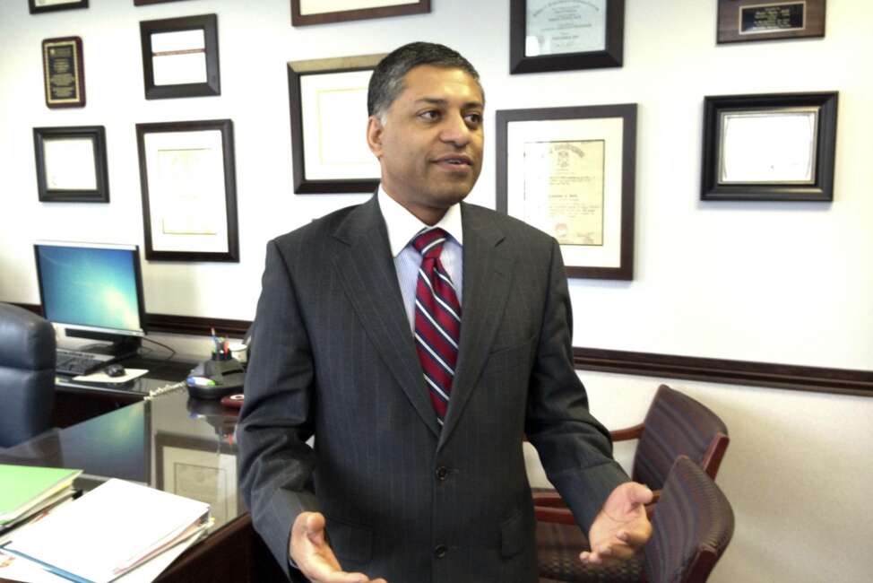 FILE -  In this Feb. 10, 2015 file photo, Dr. Rahul Gupta, state health officer of West Virginia, talks in his office in Charleston, W.Va. President Joe Biden is nominating West Virginia’s former health commissioner as the nation’s top anti-drug official, tapping an official who served on the frontlines of the nation’s opioid epidemic. The White House says Dr. Rahul Gupta will be the first physician to lead the Office of National Drug Control Policy, also known as the “drug czar.”  (AP Photo/John Raby)