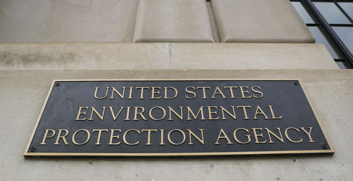 FILE - In this Sept. 21, 2017, file photo, the Environmental Protection Agency (EPA) Building is shown in Washington. Two high-ranking Trump political appointees at the EPA engaged in fraudulent payroll activities, including payments to employees after they were fired and to one of the officials when he was absent from work, that cost the agency more than $130,000, a report by an internal watchdog says. Former chief of staff Ryan Jackson and former White House liaison Charles Munoz submitted “official timesheets and personnel forms that contained materially false, fictitious, and fraudulent statements
