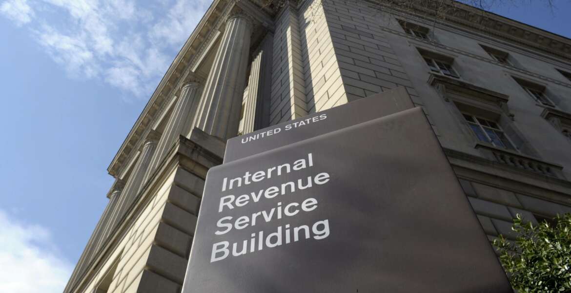 FILE - In this photo March 22, 2013 file photo, the exterior of the Internal Revenue Service (IRS) building in Washington. A complaint filed with the IRS alleges that a conservative group is violating its nonpartisan and nonprofit status by using a voter data system linked to the Republican party. The complaint is against the American Legislative Exchange Council. (AP Photo/Susan Walsh, File)