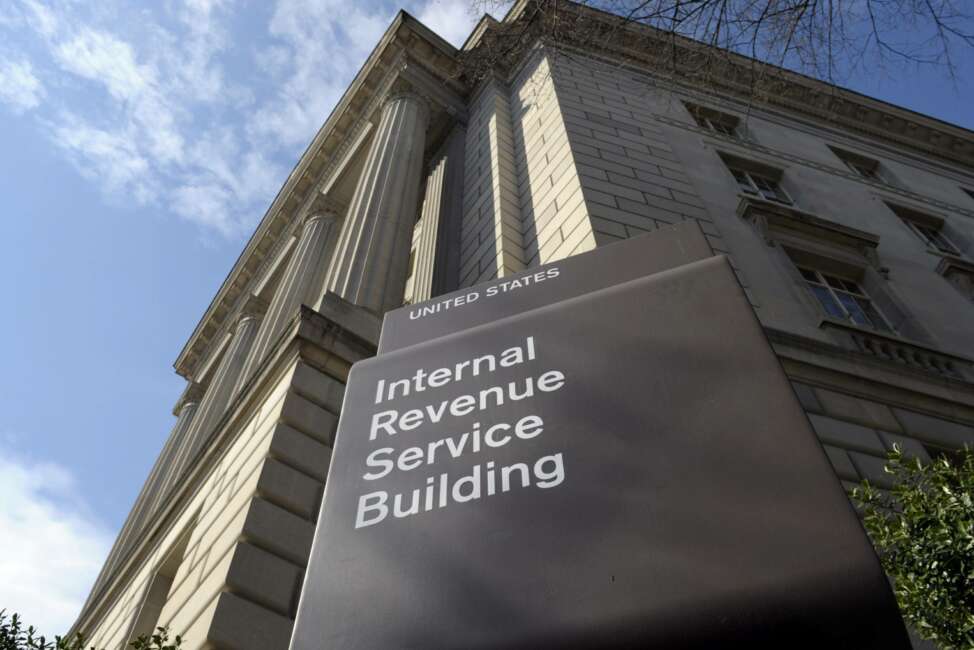 FILE - In this photo March 22, 2013 file photo, the exterior of the Internal Revenue Service (IRS) building in Washington. A complaint filed with the IRS alleges that a conservative group is violating its nonpartisan and nonprofit status by using a voter data system linked to the Republican party. The complaint is against the American Legislative Exchange Council. (AP Photo/Susan Walsh, File)