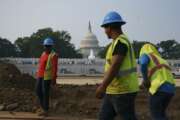 Workers repair a park near the Capitol in Washington, Wednesday, July 21, 2021.  About 8 in 10 Americans favor plans to increase funding for roads, bridges and ports and for pipes that supply drinking water. But a new poll from The Associated Press-NORC Center for Public Affairs Research shows that’s about as far as Democrats and Republicans intersect on infrastructure. P (AP Photo/J. Scott Applewhite)