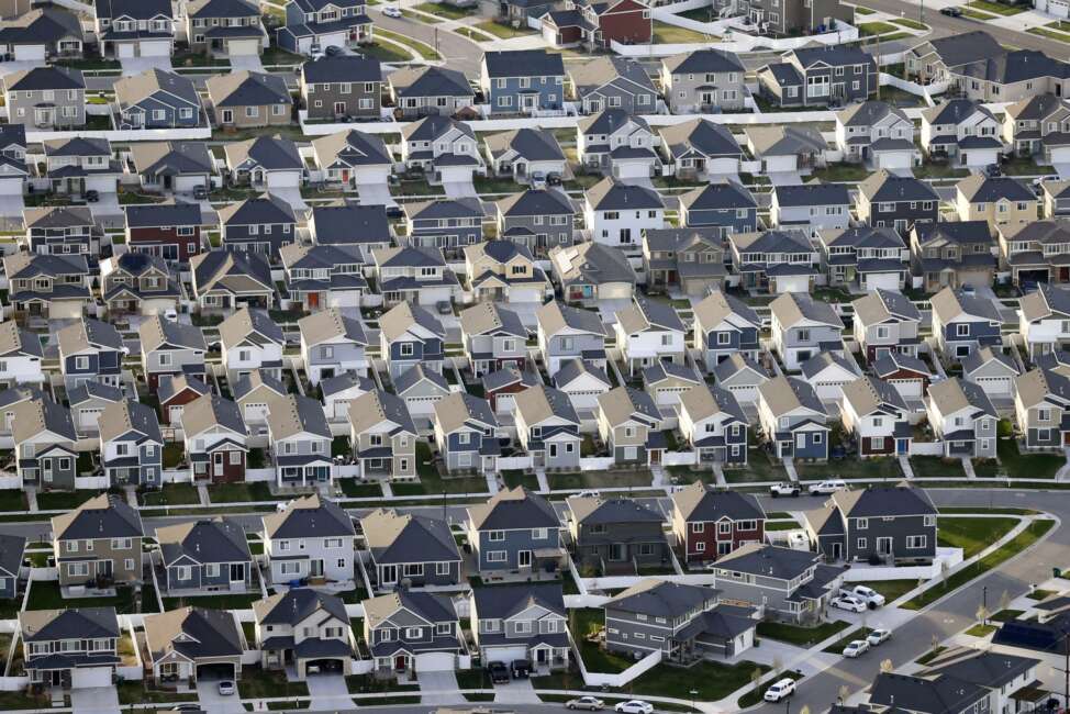 FILE - Rows of homes, are shown in suburban Salt Lake City, on April 13, 2019. The U.S. Census Bureau's release Thursday, Aug. 12, 2021, of detailed population and demographic changes in each state will kick off the once-a-decade redistricting process that plays a large role in determining which party controls state legislatures and the U.S. House. (AP Photo/Rick Bowmer, File)