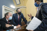 From left, Rep. Ed Perlmutter, D-Colo., Rep. Jamie Raskin, D-Md., and Rep. Joe Neguse, D-Colo., confer after a brief meeting of the House Rules Committee, at the Capitol in Washington, Tuesday, Aug. 24, 2021. (AP Photo/J. Scott Applewhite)