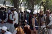 Afghans wait for hours to try to withdraw money, in front of Kabul Bank, in Kabul, Afghanistan, Saturday, Aug. 28, 2021. (AP Photo/Khwaja Tawfiq Sediqi)