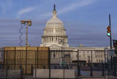 Security fencing and video surveillance equipment has been installed around the Capitol in Washington, Thursday, Sept. 16, 2021, ahead of a planned Sept. 18 rally by far-right supporters of former President Donald Trump who are demanding the release of rioters arrested in connection with the 6 January insurrection. (AP Photo/J. Scott Applewhite)