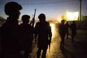 FILE - In this Oct. 18, 2013, file photo Afghan police arrive to secure the area after a car bomb detonated outside an ISAF civilian personnel compound in Kabul, Afghanistan. Police said the assault started at dusk when a car exploded near the gate of a compound, housing contractors from various countries, European diplomatic personnel and United Nations employees. Military contractors got up to half of the $14 trillion spent by the Pentagon since 9/11, a study by Brown University’s Costs of War project and the Center for International Policy said Monday, Sept. 13, 2021. The U.S. saw about 7,000 military members die in all post-9/11 conflicts, but nearly 8,000 contractors, another Costs of War study estimates. (AP Photo/Anja Niedringhaus, File)