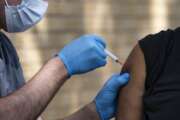 FILE - In this May 27, 2021, file photo, National Guard Spc. Noah Vulpi, left, administers the Johnson &amp; Johnson COVID-19 vaccine to Ira Young Jr. during a vaccination clinic held by the National Guard in Odessa, Texas. Larger U.S. businesses won't have to decide whether to require their employees to get vaccinated against COVID-19. Doing so is now federal policy, although many of the details have yet to be worked out.
President Joe Biden announced sweeping new orders Thursday, Sept. 9, that will require employers with more than 100 workers to mandate immunizations or offer weekly testing. (Eli Hartman/Odessa American via AP, File)