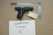 FILE - This evidence photo from the criminal complaint of the U.S. District Court for Massachusetts v. Ashley Bigsbee for illegal possession of a stolen firearm on Nov. 15, 2015, in Suffolk, Mass., shows one of ten M11 semiautomatic handguns that former Army Reserve member James Morales stole from the Lincoln Stoddard Army Reserve Center in Worcester, Mass. Overall, AP has found that at least 2,000 firearms from the Army, Marines, Navy or Air Force were lost or stolen during the 2010s. (U.S. District Court for Massachusetts via AP)