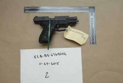 FILE - This evidence photo from the criminal complaint of the U.S. District Court for Massachusetts v. Ashley Bigsbee for illegal possession of a stolen firearm on Nov. 15, 2015, in Suffolk, Mass., shows one of ten M11 semiautomatic handguns that former Army Reserve member James Morales stole from the Lincoln Stoddard Army Reserve Center in Worcester, Mass. Overall, AP has found that at least 2,000 firearms from the Army, Marines, Navy or Air Force were lost or stolen during the 2010s. (U.S. District Court for Massachusetts via AP)