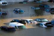 FILE - In this Sept. 2, 2021, file photo, vehicles are submerged in water during flooding in Philadelphia in the aftermath of downpours and high winds from the remnants of Hurricane Ida that hit the area. (AP Photo/Matt Rourke, File)