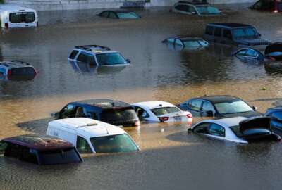 FILE - In this Sept. 2, 2021, file photo, vehicles are submerged in water during flooding in Philadelphia in the aftermath of downpours and high winds from the remnants of Hurricane Ida that hit the area. (AP Photo/Matt Rourke, File)