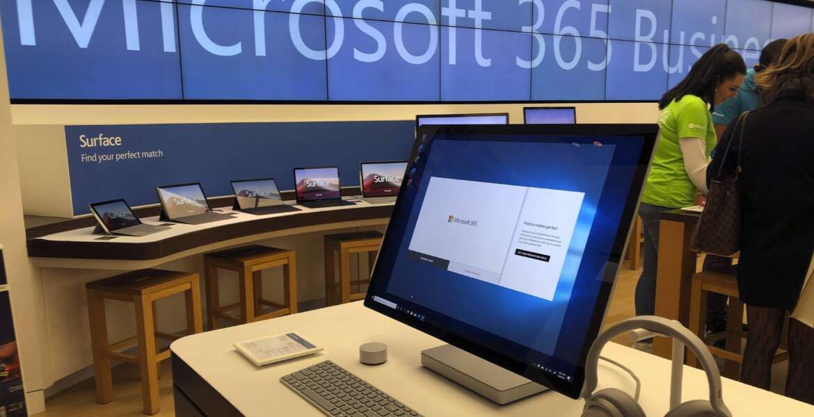 FILE - In this Jan. 28, 2020, file photo, a Microsoft computer is among items displayed at a Microsoft store in suburban Boston. Microsoft says the same Russia-backed hackers responsible for the 2020 SolarWinds breach continue to attack the global technology supply chain and are have been relentlessly targeting cloud service resellers and others since summer. (AP Photo/Steven Senne, File)