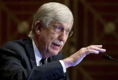 FILE - Dr. Francis Collins, director of the National Institutes of Health, appears before a Senate Health, Education, Labor and Pensions Committee hearing to discuss vaccines and protecting public health during the coronavirus pandemic on Capitol Hill, on Wednesday, Sept. 9, 2020, in Washington. Collins says he is stepping down by the end of the year, having led the research center for 12 years and becoming a prominent source of public information during the coronavirus pandemic. A formal announcement was expected Tuesday, Oct. 5, 2021 from NIH. (Michael Reynolds/Pool via AP, File)