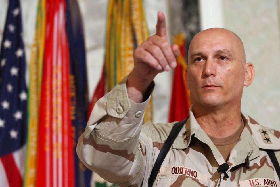 FILE - In this Aug. 7, 2003 file photo, Major General Raymond Odierno, commander of the U.S. Army Fourth Infantry Division gestures during a news conference in Tikrit, about 180 kms. (112 miles) northwest of Baghdad, Iraq.  Odierno, a retired Army general who commanded American and coalition forces in Iraq at the height of the war and capped a 39-year career by serving as the Army's chief of staff, has died, his family said Saturday, Oct. 9, 2021. He was 67.  (AP Photo/Dario Lopez-Mills, File)