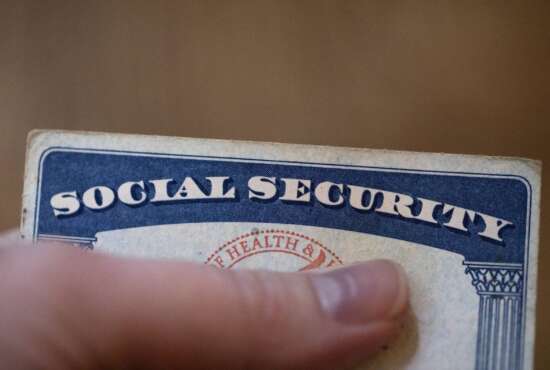 This Tuesday, Oct. 12, 2021, photo shows a Social Security card in Tigard, Ore.  Millions of retirees on Social Security will get a 5.9% boost in benefits for 2022. The biggest cost-of-living adjustment in 39 years follows a burst in inflation as the economy struggles to shake off the drag of the coronavirus pandemic.  (AP Photo/Jenny Kane)