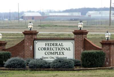 FILE - The Yazoo City Federal Corrections Complex in Yazoo City, Miss., is shown Feb. 9, 2007. At the federal prison in Yazoo City, Mississippi, the official tasked with investigating staff misconduct has been the subject of numerous complaints and has been arrested multiple times. But the Bureau of Prisons has not removed him from the position and did not suspend him after his arrests, which is a standard practice when Justice Department employees are arrested for criminal offenses. (AP Photo/Rogelio V. Solis, File)