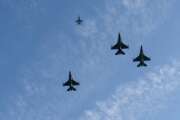 A formation of U.S. Air Force F-16 Fighting Falcons fly over during a centennial ceremony for the Tomb of the Unknown Soldier, in Arlington National Cemetery, on Veterans Day, Thursday, Nov. 11, 2021, in Arlington, Va. (AP Photo/Alex Brandon, Pool)