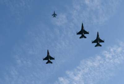 A formation of U.S. Air Force F-16 Fighting Falcons fly over during a centennial ceremony for the Tomb of the Unknown Soldier, in Arlington National Cemetery, on Veterans Day, Thursday, Nov. 11, 2021, in Arlington, Va. (AP Photo/Alex Brandon, Pool)