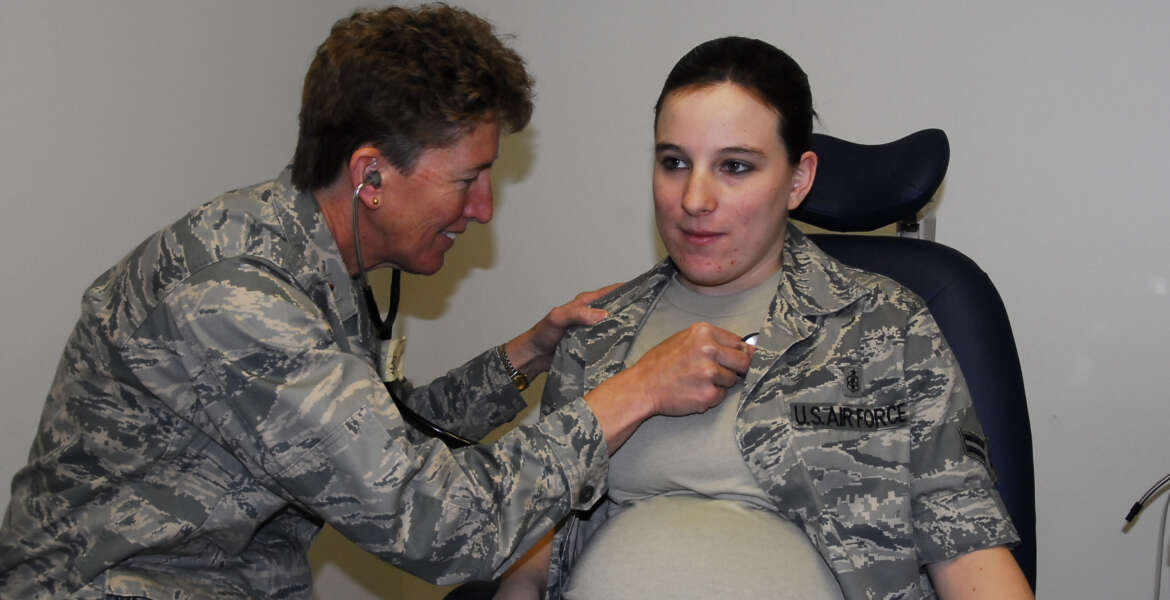 Airman First Class Brandy Fraher, who is in the final stages of her pregnancy, receives an examination from Major Noreen Burke during a unit training assembly. With restrictions, non flying pregnant Reservists may participate in all UTAs and annual tours until the 34th week of the pregnancy.