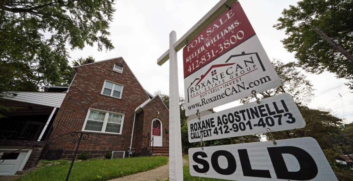 This is a home sold in Mount Lebanon, Pa., on Tuesday, Sept. 21, 2021.   Mortgage buyer Freddie Mac reported Thursday, Dec. 9,  that the average rate on the benchmark 30-year, fixed rate home loan ticked down this week to 3.10% from 3.11% last week.   (AP Photo/Gene J. Puskar)