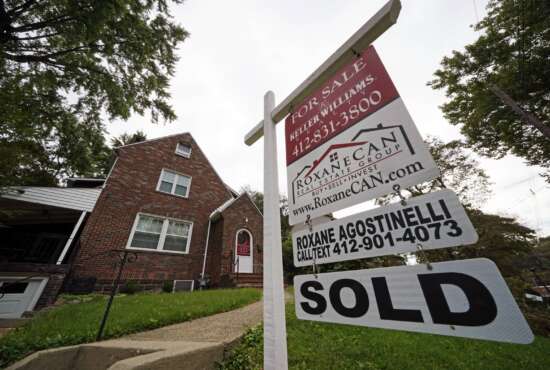 This is a home sold in Mount Lebanon, Pa., on Tuesday, Sept. 21, 2021.   Mortgage buyer Freddie Mac reported Thursday, Dec. 9,  that the average rate on the benchmark 30-year, fixed rate home loan ticked down this week to 3.10% from 3.11% last week.   (AP Photo/Gene J. Puskar)
