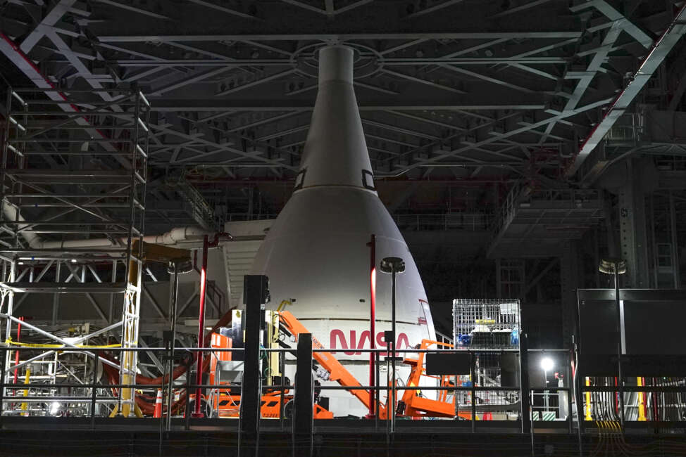 A section of the Artemis rocket with the Orion space capsule is seen inside the Vehicle Assembly Building at the Kennedy Space Center, Friday, Nov. 5, 2021, in Cape Canaveral, Fla. Artemis will launch the next generation of deep space operations, including missions on and around the Moon. (AP Photo/John Raoux)