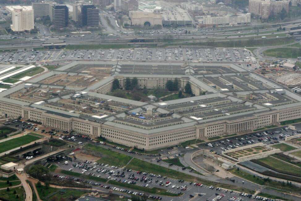 FILE - This March 27, 2008, file photo, shows the Pentagon in Washington. The U.S. Army, for the first time, is offering a maximum enlistment bonus of $50,000 to highly skilled recruits who sign up for six years. (AP Photo/Charles Dharapak, File)