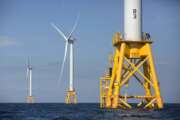 FILE - This photo from Aug. 15, 2016, shows offshore wind turbines near Block Island, R.I. The Biden administration said Wednesday it will hold its first offshore wind auction next month, offering nearly 500,000 acres off the coast of New York and New Jersey for wind energy projects that could produce enough electricity to power nearly 2 million homes. (AP Photo/Michael Dwyer, File)