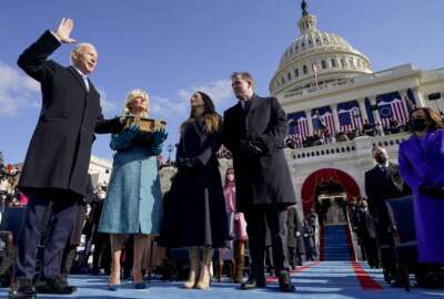 FILE - Joe Biden is sworn in as the 46th president of the United States by Chief Justice John Roberts as Jill Biden holds the Bible during the 59th Presidential Inauguration at the U.S. Capitol in Washington, on Jan. 20, 2021, as their children Ashley and Hunter watch.(AP Photo/Andrew Harnik, Pool, File)