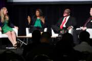 DoD's Kelly Fletcher (left), Vernita Harris and Fred Morefield discuss electromagnetic spectrum at the recent Association of Old Crows International Symposium and Convention.