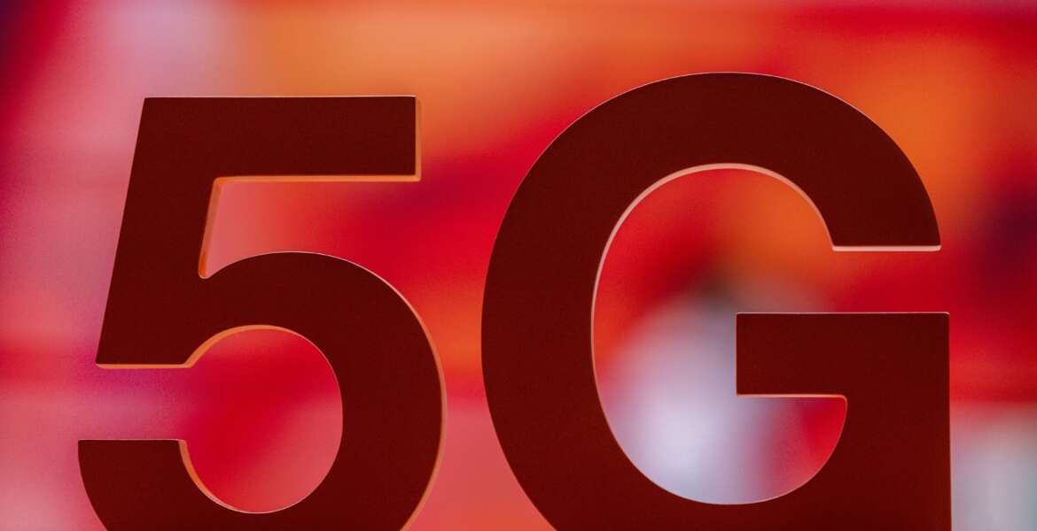 FILE - A 5G sign placed at the Orange booth during the Mobile World Congress 2021 in Barcelona, Spain, on June, 29, 2021. A European Union watchdog warned on Monday, Jan. 24, 2022 that the EU faces much bigger economic and security threats unless member countries step up cooperation. (AP Photo/Bernat Armangue, File)