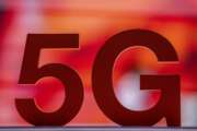 FILE - A 5G sign placed at the Orange booth during the Mobile World Congress 2021 in Barcelona, Spain, on June, 29, 2021. A European Union watchdog warned on Monday, Jan. 24, 2022 that the EU faces much bigger economic and security threats unless member countries step up cooperation. (AP Photo/Bernat Armangue, File)