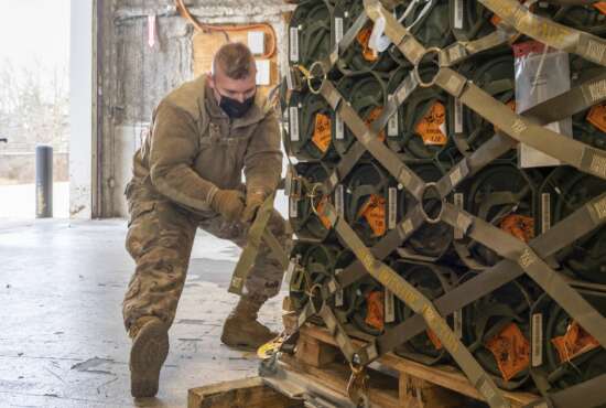 In this image provided by the U.S. Air Force, Senior Airman Zachary Kline, 436th Aerial Port Squadron cargo processor, palletizes ammunition, weapons and other equipment bound for Ukraine during a foreign military sales mission at Dover Air Force Base, Del., Jan. 21, 2022. Since 2014, the U.S. has committed more than $5.4 billion in total assistance to Ukraine, including security and non-security assistance.(Mauricio Campino/U.S. Air Force via AP)