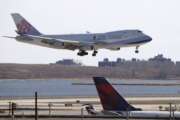 FILE - A China Airlines cargo jet lands at John F. Kennedy International Airport, Saturday, March 14, 2020, in New York. On Monday, Jan. 3, 2022, AT&amp;T and Verizon said they will delay activating new 5G wireless service for two weeks following a request by Transportation Secretary Pete Buttigieg, who cited the airline industry’s concern that the service could interfere with systems on planes. (AP Photo/Kathy Willens, File)