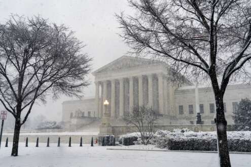 The Supreme Court is seen as a winter storm delivers heavy snow to Capitol Hill in Washington