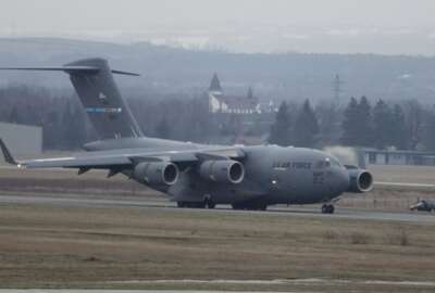 A U.S. Army transport plane landing at the Rzeszow-Jasionka airport in southeastern Poland on Sunday, Feb. 6, 2022, bringing from Fort Bragg troops and equipment of the 82nd Airborne Division. Additional U.S. troops are arriving in Poland after President Joe Biden ordered the deployment of 1,700 soldiers here amid fears of a Russian invasion of Ukraine. Some 4,000 U.S. troops have been stationed in Poland since 2017. (AP Photo/Czarek Sokolowski)