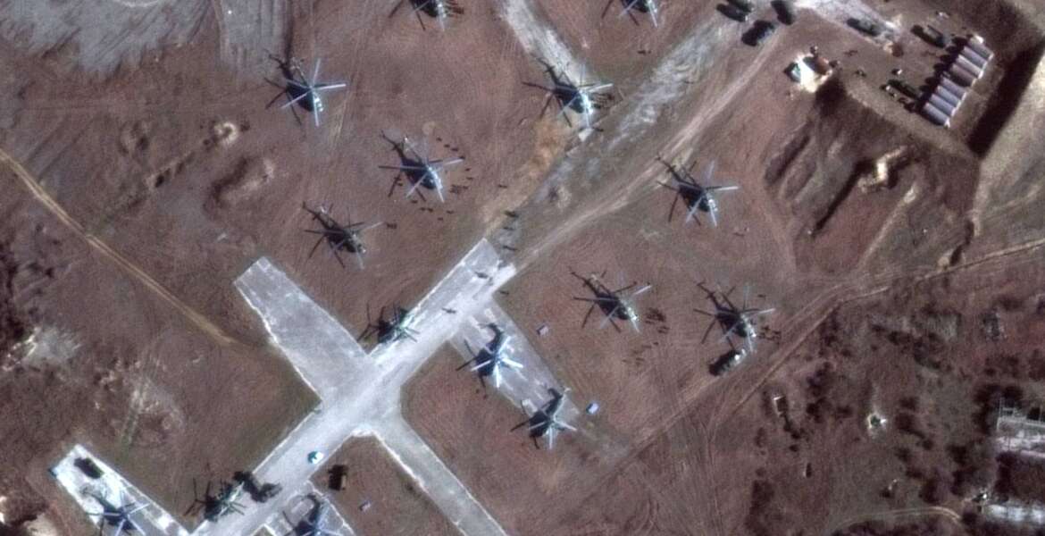 This Sunday, Feb. 13, 2022, satellite image provided by Maxar Technologies shows the close up of helicopters and troops near Lake Donuzlav, Crimea. (Satellite image ©2022 Maxar Technologies via AP)