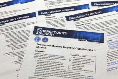 A Joint Cybersecurity Advisory published by the Cybersecurity & Infrastructure Security Agency about destructive malware that is targeting organizations in Ukraine is photographed Monday, Feb. 28, 2022. (AP Photo/Jon Elswick)
