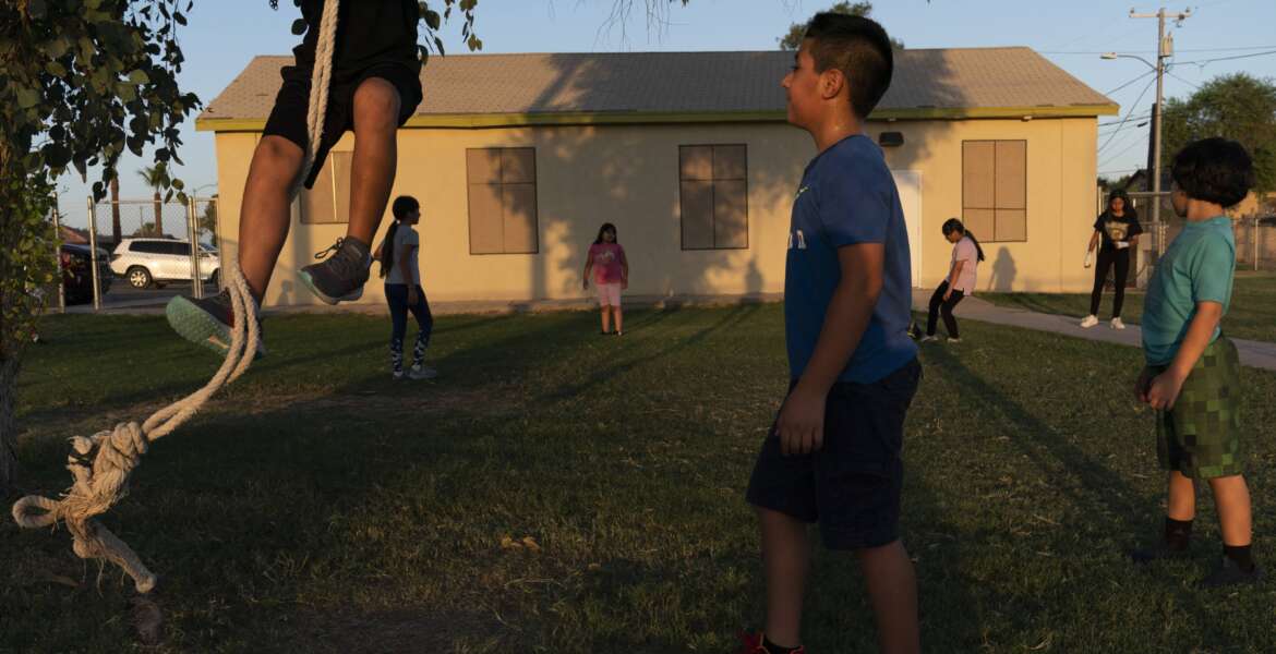 FILE - Children play in the yard of a community boxing club Thursday, Aug. 19, 2021, in Somerton, Ariz. The U.S. Census Bureau on Thursday, March 10, 2022, released two reports which measure how well the once-a-decade head count tallied every U.S. resident and whether certain populations were undercounted or overrepresented in the count. Any undercounts in various populations can shortchange the amount of funding and political representation they get over the next decade. (AP Photo/Jae C. Hong, File)
