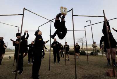 FILE - U.S Army troops training to serve as instructors participate in the new Army combat fitness test at the 108th Air Defense Artillery Brigade compound at Fort Bragg, N.C., Jan. 8, 2019. After three years of complaints and debate, the Army has dumped plans to have a physical fitness test that is gender and age neutral, and will now allow women and older soldiers to pass with lower scores. (AP Photo/Gerry Broome, File)