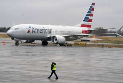 FILE - An American Airlines Boeing 737 Max jet plane is parked at a maintenance facility in Tulsa, Okla., Wednesday, Dec. 2, 2020. A former Boeing test pilot is going on trial Friday, March 18, 2022, on charges of misleading regulators about the Boeing 737 Max, the model that was involved in two deadly crashes. Mark Forkner faces four counts of fraud. (AP Photo/LM Otero, File)