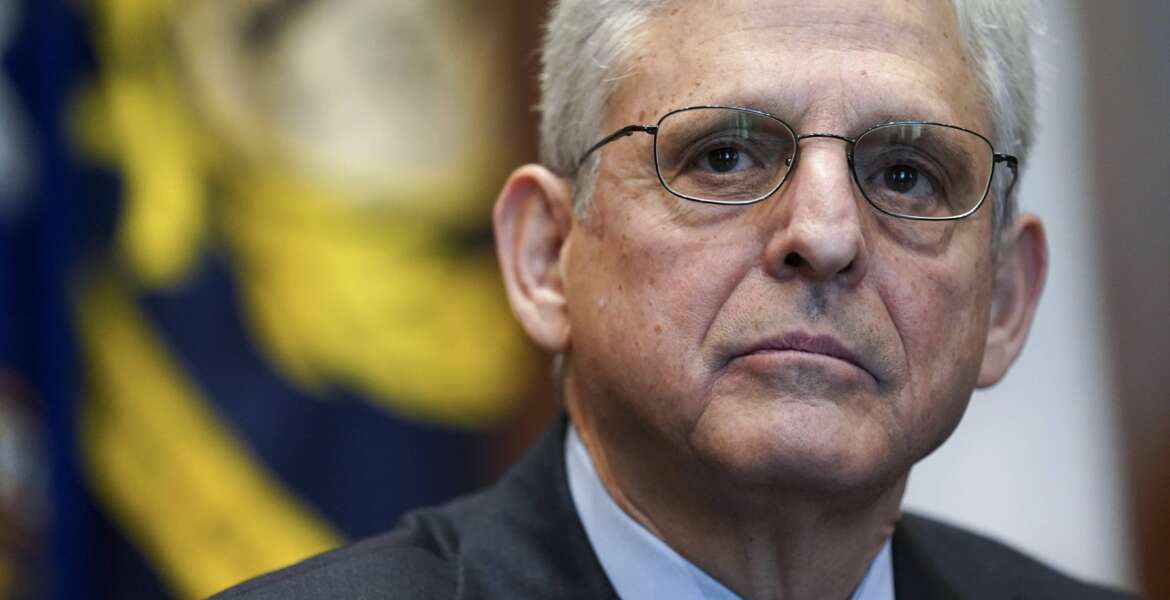 FILE - Attorney General Merrick Garland listens during a meeting of the COVID-19 Fraud Enforcement Task Force at the Justice Department, March 10, 2022 in Washington. Treasury Secretary Janet Yellen and Garland on Wednesday, March 16, for the first time convened a multilateral task force known as REPO, short for Russian Elites, Proxies and Oligarchs, one of several new efforts dedicated to enforcing sanctions against Russian oligarchs over the war in Ukraine. (Kevin Lamarque/Pool via AP, File)