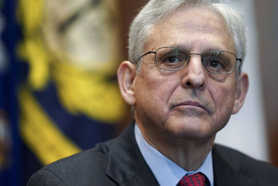 FILE - Attorney General Merrick Garland listens during a meeting of the COVID-19 Fraud Enforcement Task Force at the Justice Department, March 10, 2022 in Washington. Treasury Secretary Janet Yellen and Garland on Wednesday, March 16, for the first time convened a multilateral task force known as REPO, short for Russian Elites, Proxies and Oligarchs, one of several new efforts dedicated to enforcing sanctions against Russian oligarchs over the war in Ukraine. (Kevin Lamarque/Pool via AP, File)