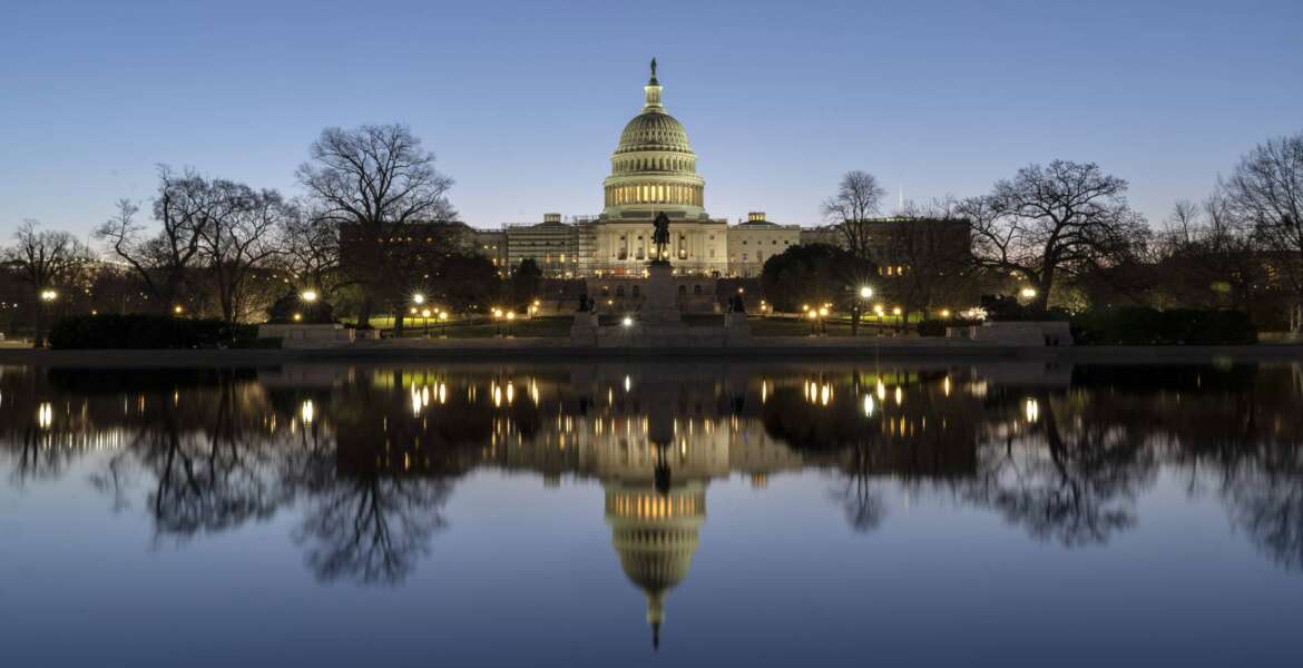 The U.S. Capitol building is seen before sunrise on Capitol Hill in Washington, Monday, March. 21, 2022. The Senate Judiciary Committee is set to begin its historic confirmation hearings for Judge Ketanji Brown Jackson. The 51-year-old federal judge would be the first Black woman on the Supreme Court. (AP Photo/Gemunu Amarasinghe)