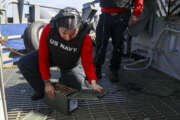 PHILIPPINE SEA (April 28, 2022) Aviation Ordnanceman 3rd Class Kennedy Lunavasquez, from Los Angeles, prepares to load ammunition into a .50 caliber machine gun during a live-fire exercise aboard the Nimitz-class aircraft carrier USS Abraham Lincoln (CVN 72). Abraham Lincoln Strike Group is on a scheduled deployment in the U.S. 7th Fleet area of operations to enhance interoperability through alliances and partnerships while serving as a ready-response force in support of a free and open Indo-Pacific region. (U.S. Navy photo by Mass Communication Specialist 3rd Class Javier Reyes)