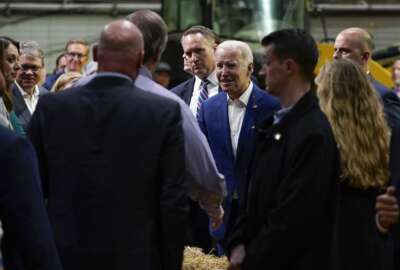 President Joe Biden talks to guests after speaking at POET Bioprocessing in Menlo, Iowa, Tuesday, April 12, 2022. (AP Photo/Carolyn Kaster)