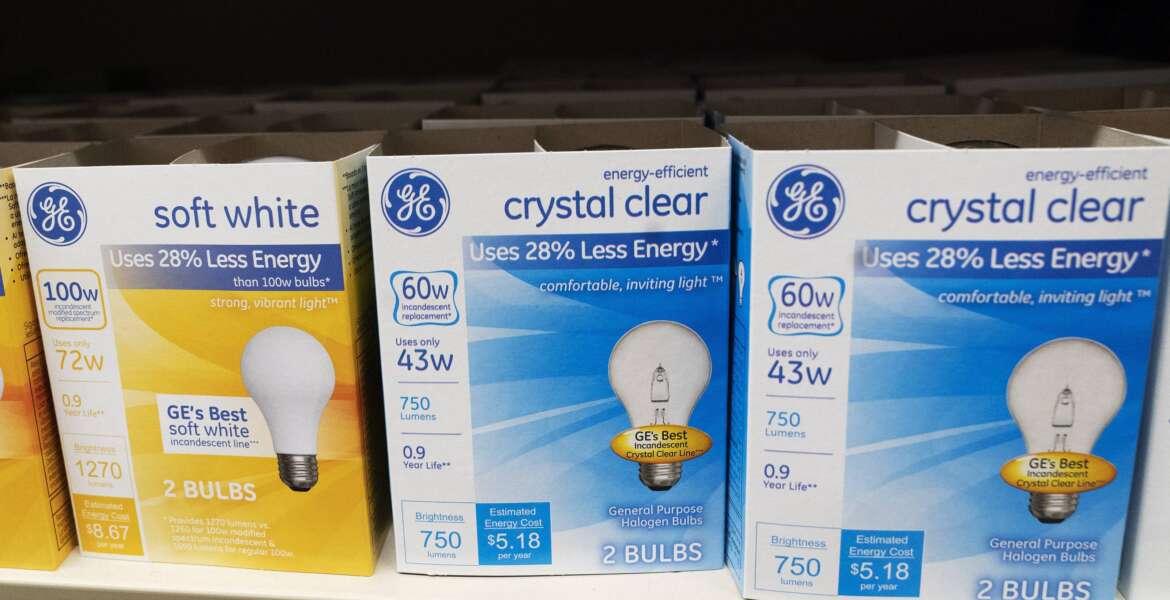 FILE - General Electric light bulbs are displayed in a supermarket April 5, 2021 in New York. The Biden administration is scrapping old-fashioned incandescent light bulbs. Rules finalized by the Energy Department will require manufacturers to sell energy-efficient lightbulbs, accelerating a longtime industry practice to use compact fluorescent and LED bulbs that last 25 to 50 times longer than incandescent bulbs. (AP Photo/Mark Lennihan, File)